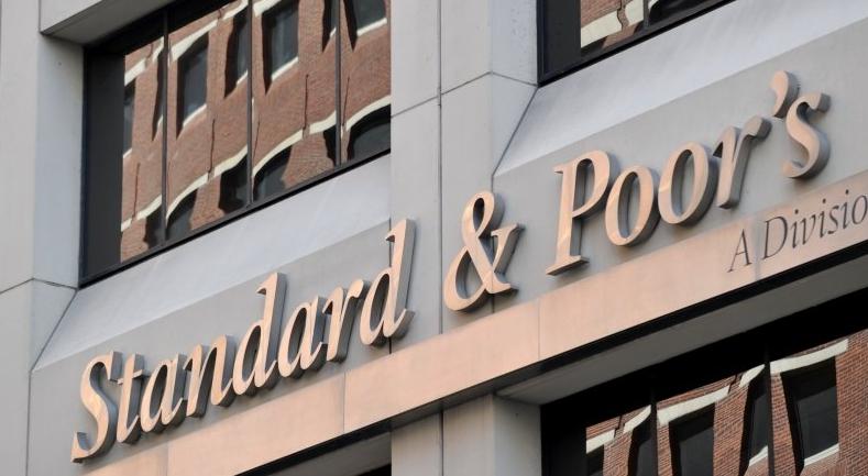 S&P downgrades UK rating outlook