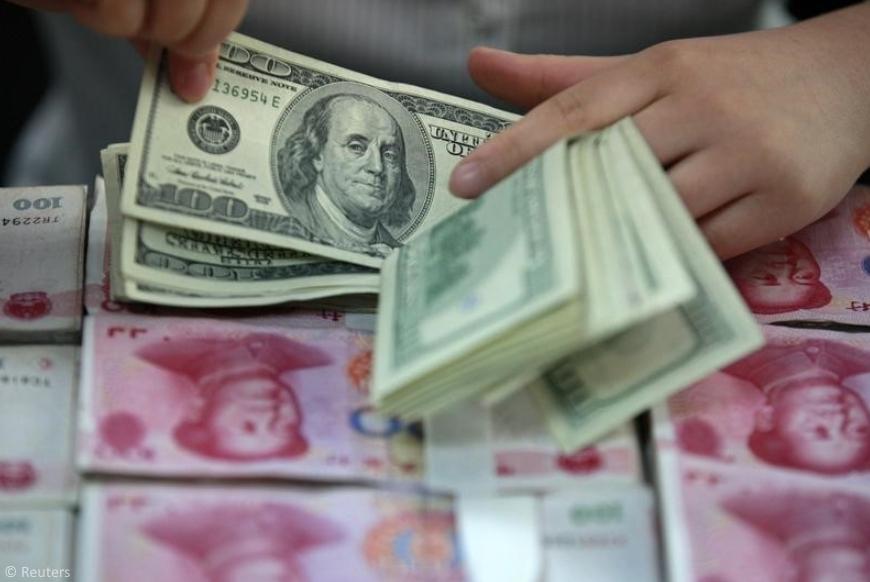 Chinese banks sell dollars to support the yuan